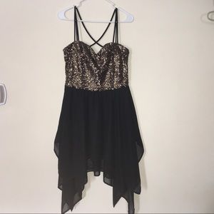 A sequined dress with shark bite ends